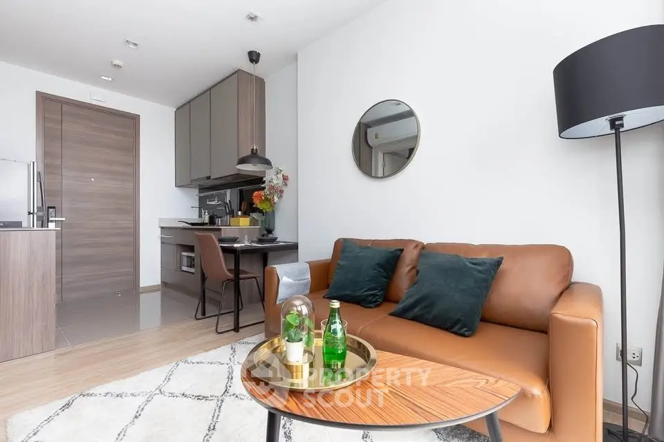 Modern living room with stylish decor and open kitchen layout in a contemporary apartment.
