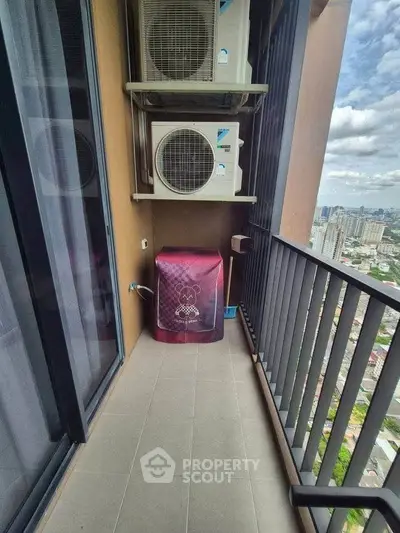 High-rise balcony with city view and air conditioning units, perfect for urban living.