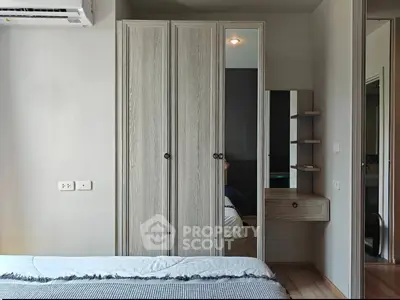 Modern bedroom with stylish wardrobe and cozy bed setup