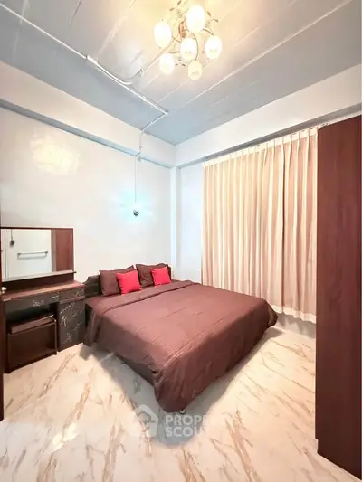 Cozy bedroom with elegant lighting and modern decor, featuring a comfortable bed and stylish curtains.
