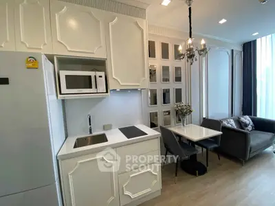 Modern kitchen with elegant dining area and cozy living space