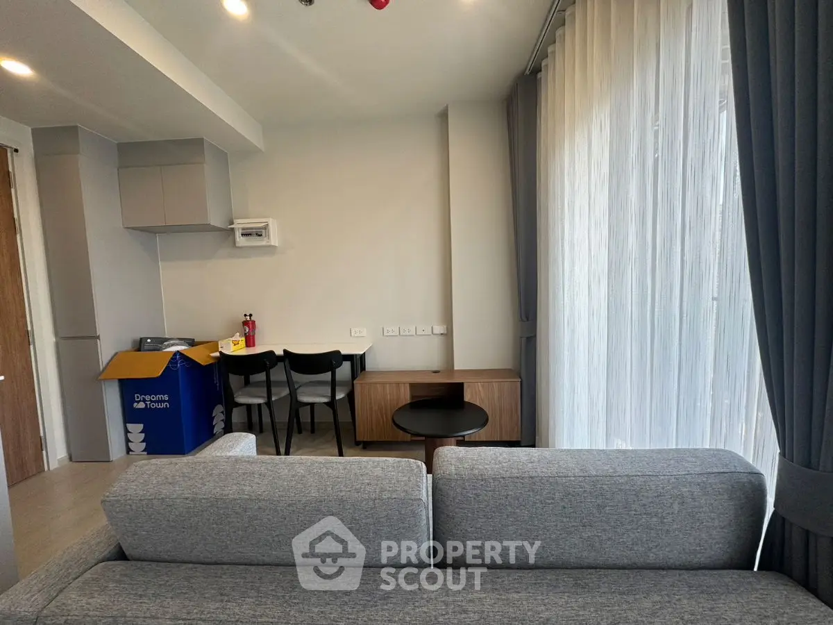 Modern living room with sleek furniture and natural light