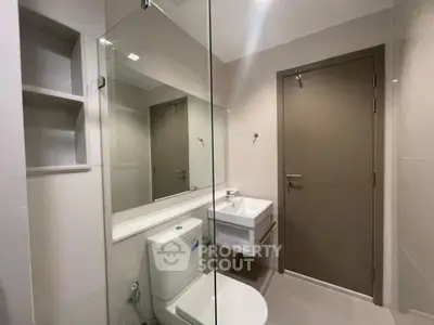 Modern bathroom with sleek fixtures and minimalist design.