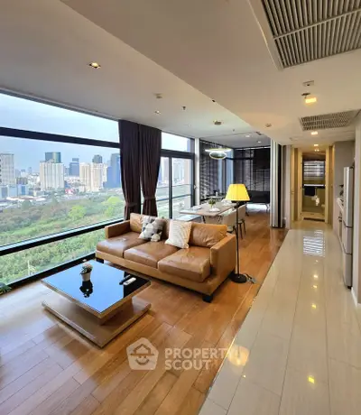 Luxurious living room with stunning city view and modern furnishings in high-rise apartment.