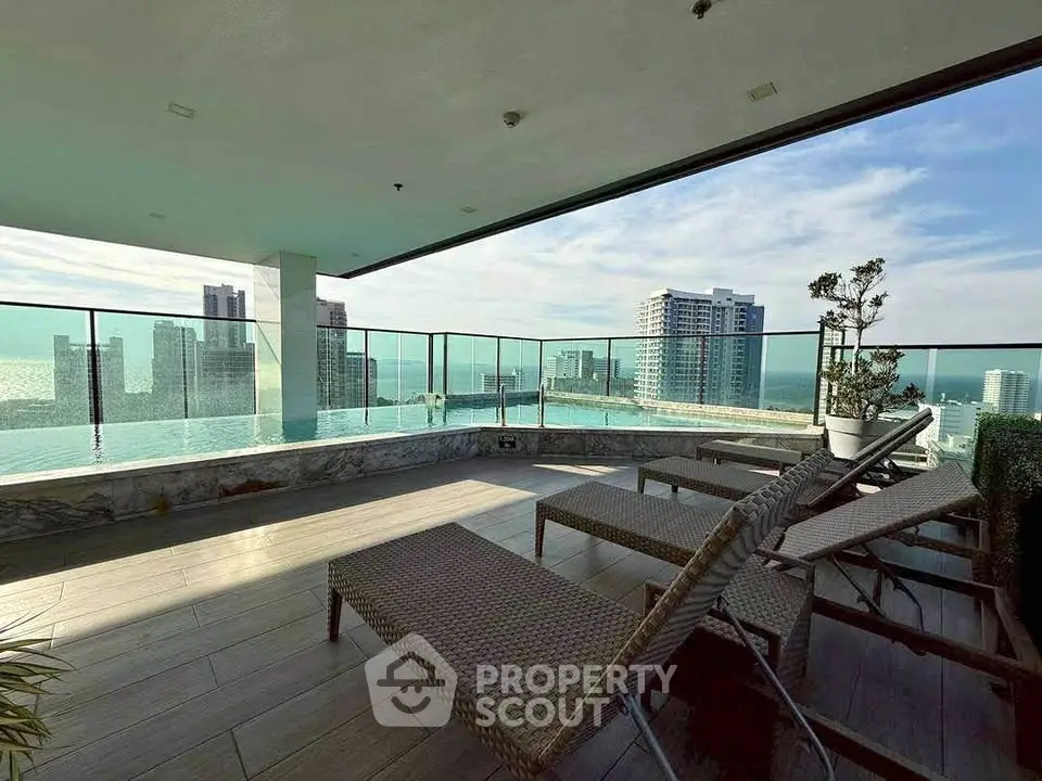 Luxurious rooftop with stunning ocean view and modern lounge chairs