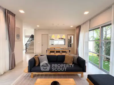 Spacious modern living room with elegant decor and garden view