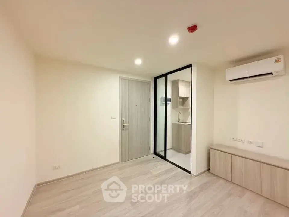 Modern minimalist apartment interior with open kitchen and air conditioning