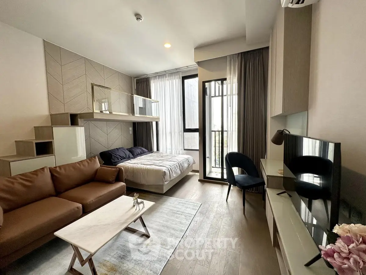 Modern studio apartment with stylish decor, featuring a cozy bed, sleek sofa, and large windows for natural light.