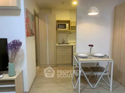 Cozy modern kitchen with dining area in compact apartment