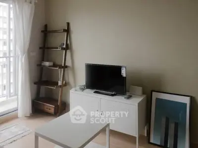 Modern living room with TV, stylish shelf, and balcony view