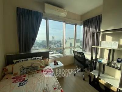 Bright bedroom with city view, featuring modern decor and ample natural light.