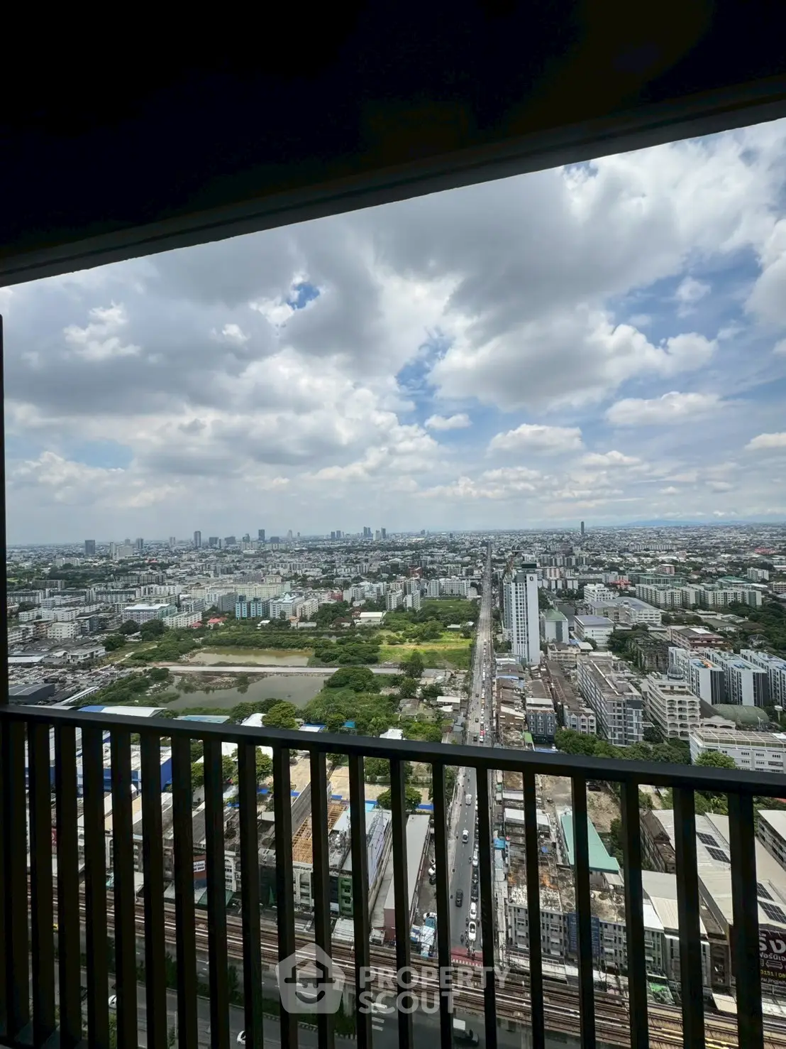 Stunning cityscape view from high-rise balcony with expansive skyline