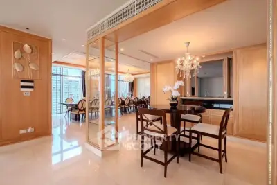 Luxurious dining area with elegant chandelier and spacious layout in high-end apartment.