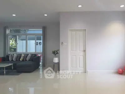 Spacious modern living room with large windows and stylish decor