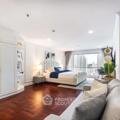 Luxurious bedroom with city view, elegant decor, and spacious layout in modern apartment.