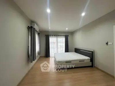 Spacious bedroom with modern design and natural light