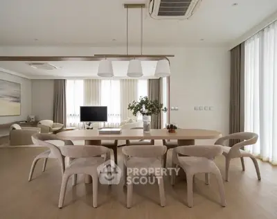 Spacious modern living room with elegant dining area and natural light