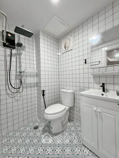 Modern bathroom with stylish tiles and sleek fixtures in a contemporary home.