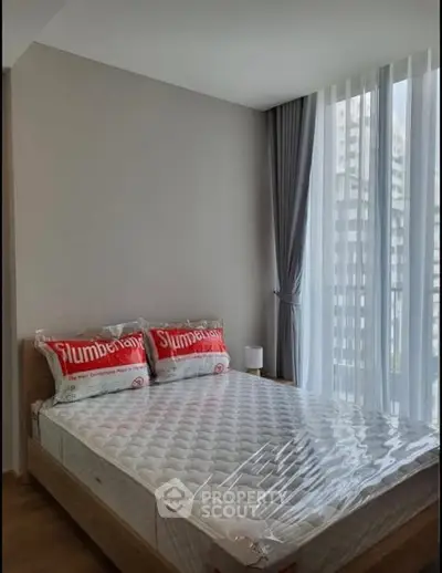 Modern bedroom with large windows and natural light