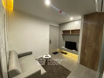 Modern living room with cozy sofa and TV unit in stylish apartment
