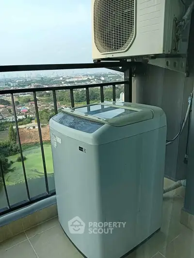 High-rise balcony with washing machine and air conditioning unit overlooking scenic city view.