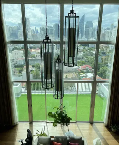 Luxurious high-rise living room with stunning city skyline view and modern decor.
