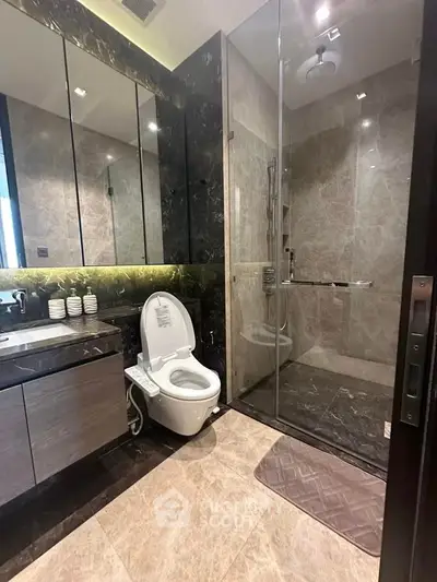 Luxurious modern bathroom with glass shower and elegant fixtures