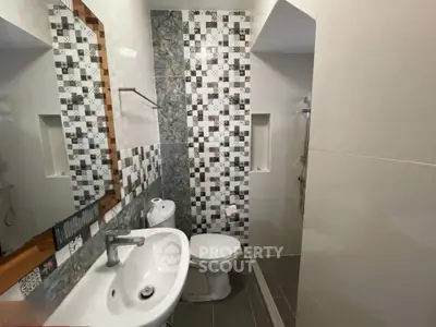 Modern bathroom with stylish tile design and sleek fixtures
