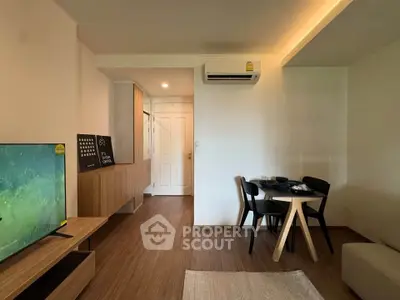 Modern living room with stylish furniture and air conditioning, perfect for comfortable living.