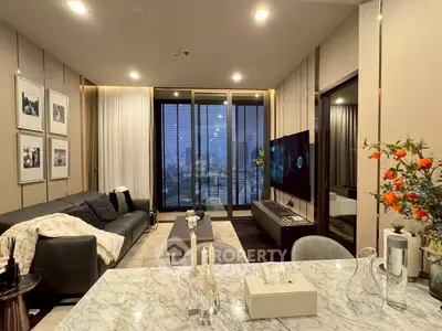 Luxurious modern living room with city view, elegant decor, and cozy ambiance