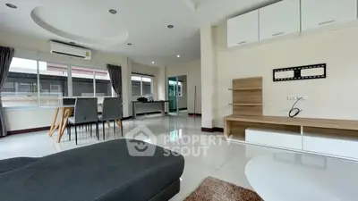 Spacious modern living room with sleek furniture and large windows