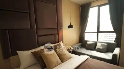 Luxurious bedroom with plush headboard and large window view