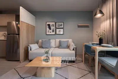 Modern living room with stylish decor and cozy dining area in open layout apartment.