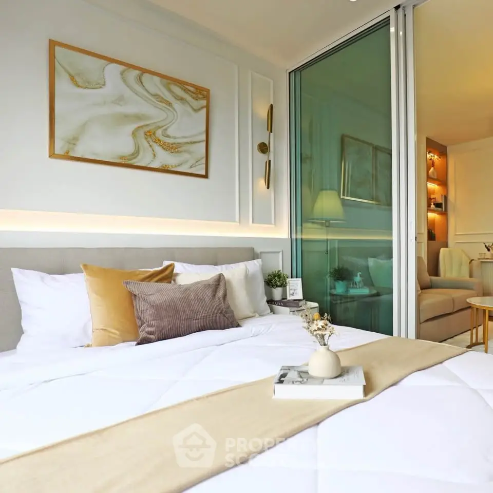 Luxurious bedroom with elegant decor and cozy ambiance, featuring a stylish open layout to the living area.