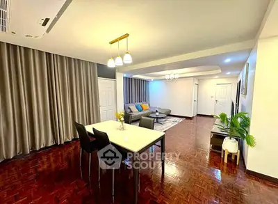 Spacious modern living room with elegant dining area and stylish decor