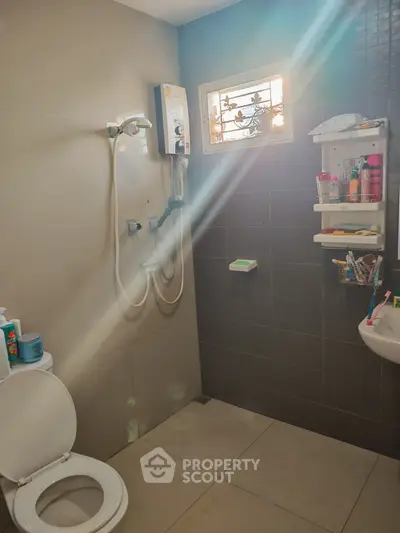 Modern bathroom with shower and natural light through window