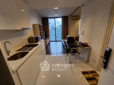 Modern open-layout kitchen and living room with city view in high-rise apartment