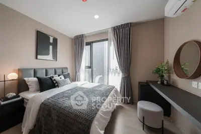 Modern bedroom with stylish decor, large window, and elegant furnishings in a cozy apartment.