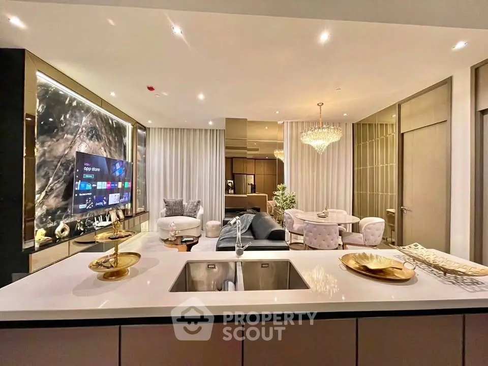 Luxurious open-plan living room with modern decor and elegant lighting