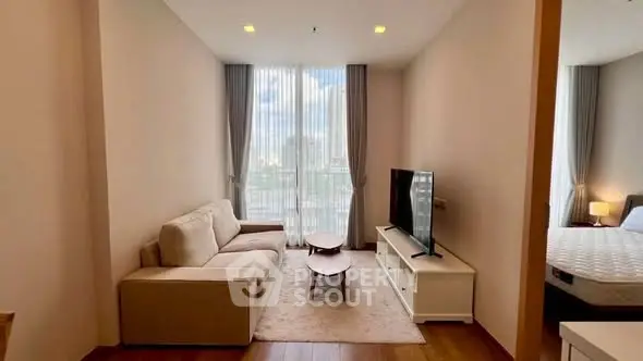 Modern living room with cozy sofa and large window offering city view