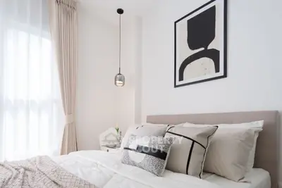 Elegant bedroom with modern decor and soft lighting