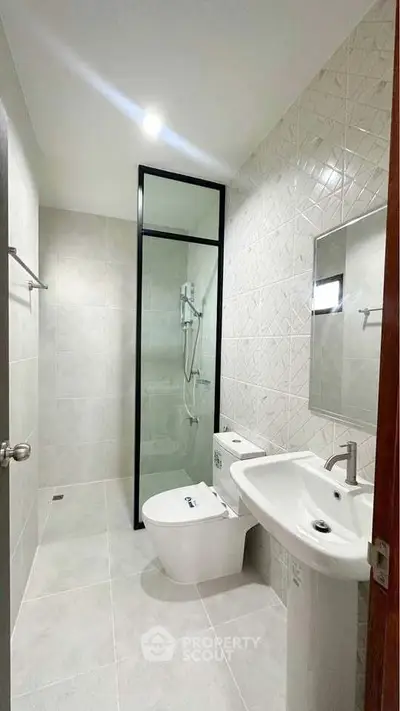 Modern bathroom with sleek design and glass shower enclosure