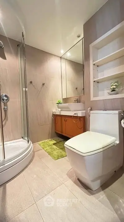 Modern bathroom with glass shower and sleek fixtures