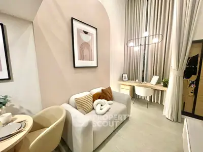 Modern living room with stylish decor and high ceilings, featuring a cozy sofa and elegant lighting.