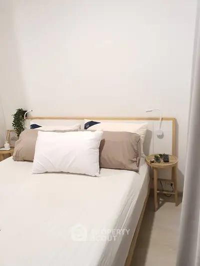 Cozy minimalist bedroom with modern decor and soft lighting