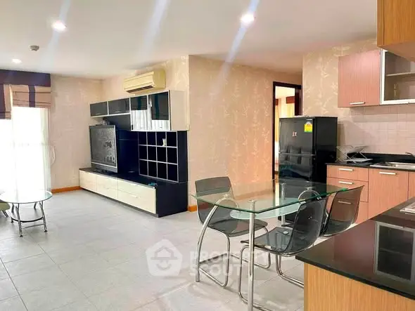 Spacious modern living room with open kitchen and stylish furniture in a bright apartment.