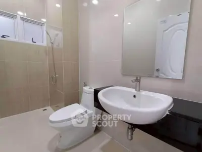 Modern bathroom with sleek fixtures and neutral tones