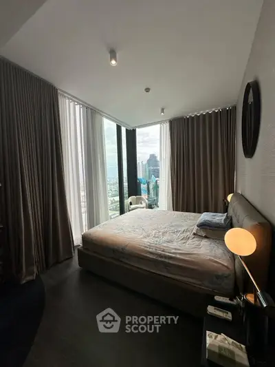 Luxurious bedroom with stunning city view and elegant decor