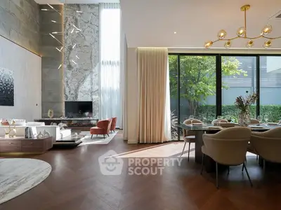 Luxurious modern living room with high ceilings and elegant dining area