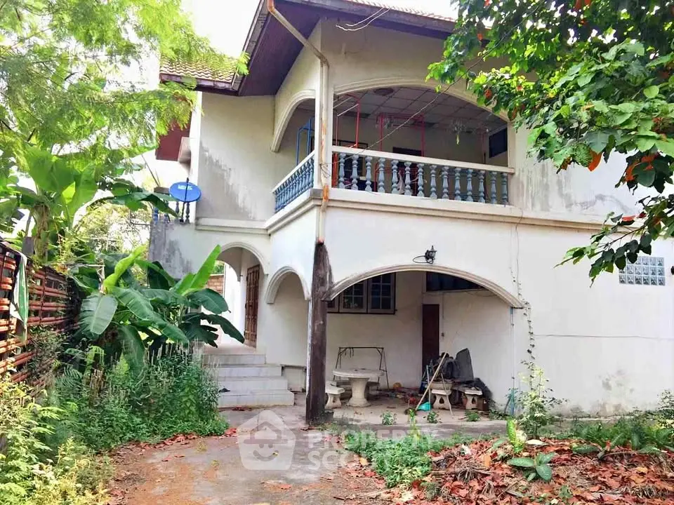 Charming two-story house with lush garden and spacious balcony